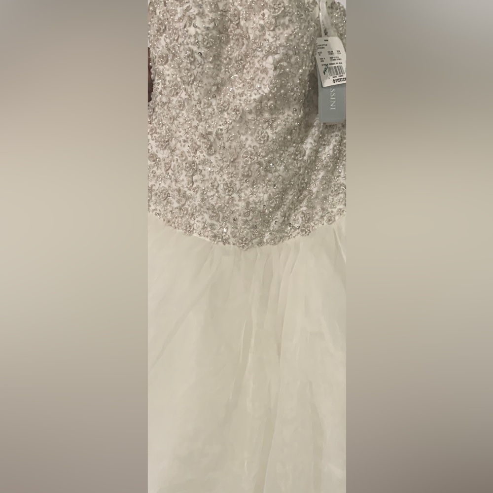 New wedding dress tags still on